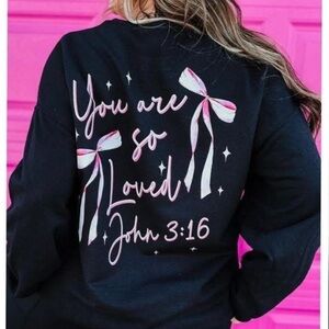 Black Sweatshirt with Pink and White Bow Design